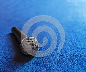 Microphone placed on a blue fabric