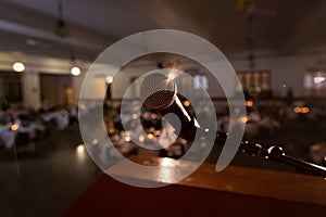 Microphone at podium in front of empty auditorium photo