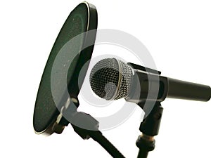 Microphone in recording studio for music, vocals, with pop filter. photo
