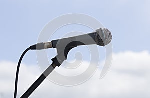Microphone on sky background