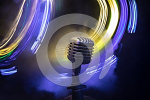 Microphone for sound, music, karaoke in audio studio or stage. Mic technology. Speech broadcast equipment. Microphone in dark room