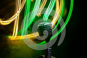 Microphone for sound, music, karaoke in audio studio or stage. Mic technology. Speech broadcast equipment. Microphone in dark room