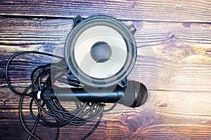 Microphone and speaker on cable with wooden table