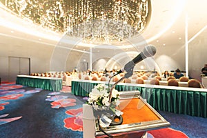 Microphone on the speech podium over the Abstract of conference
