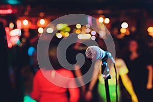 Microphone on stage against a background of auditorium.