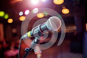 Microphone on stage against a background of auditorium