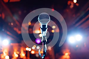 Microphone on stage against a background of auditorium