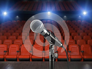Microphone on the stage of concert hall or theater with red seat