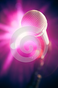 Microphone on stage with shiny glare photo