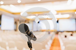 Microphone stand in conference hall blurred background with copy space. Public announcement event, Organization company meeting