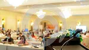 Microphone on stand at podium stage for public speaking or speech in conference hall. Mic for speaker on stage of event. Meeting