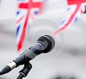 Microphone and union jack bunting at one of the concert stands at Garth Park, Bicester