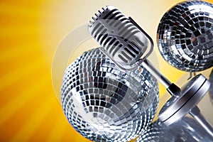 Microphone, vinyl record and Disco Balls, music saturated concep