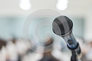 Microphone voice speaker with audiences or students in seminar classroom, lecture hall or conference meeting in educational