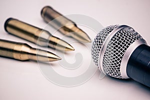 Microphone vs. Bullets