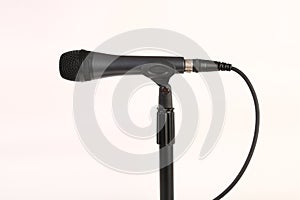 Microphone with wire on a white back ground