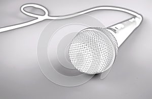 Microphone with a wire on white background. Silver mic