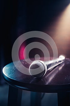 Microphone on a wood stool on a stage