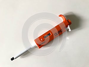 Micropipette used to transfer sample on white background photo
