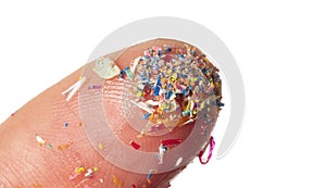 Microplastics in water - polluted water - macro photography of finger with microplatics