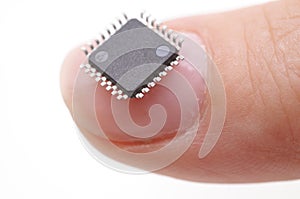 Microprocessor on girls fingertip photo