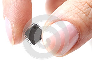 Microprocessor on girls fingertip photo