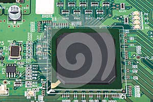 A microprocessor soldered into a green motherboard