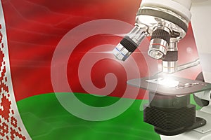 Microscope on Belarus flag background - science development concept. Research in pharmaceutical industry or biology 3D