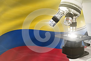 Microscope on Colombia flag background - science development concept. Research in genetics or nanotechnology 3D illustration of