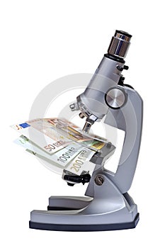 Microscope with euro banknote on white