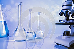 Microscope, Glassware, Laboratory beakers,Science experiment