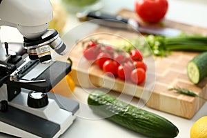 Microscope head on kitchen background