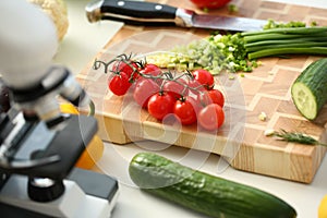 Microscope head on kitchen background