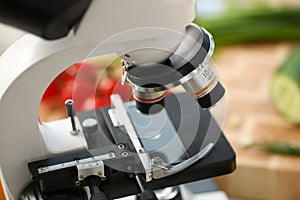 Microscope head on kitchen background