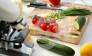 Microscope head on kitchen background