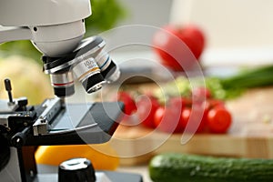 Microscope head on kitchen background