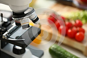 Microscope head on kitchen background