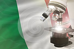 Microscope on Italy flag background - science development concept. Research in chemistry or healthcare 3D illustration of object