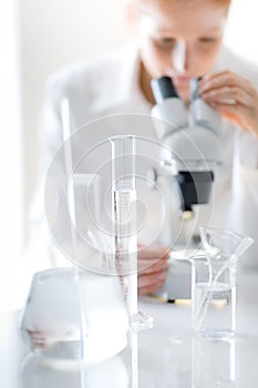 Microscope laboratory - woman medical research