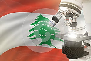 Microscope on Lebanon flag background - science development concept. Research in medicine or healthcare 3D illustration of object
