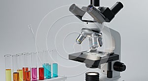 Microscope with multiple eyepieces and objective lenses positioned on a laboratory
