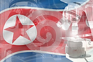 Microscope on North Korea flag - science development conceptual background. Research in physics or pharmacy, 3D illustration of