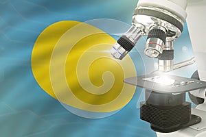 Microscope on Palau flag background - science development concept. Research in clinical medicine or biochemistry 3D illustration