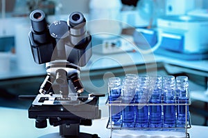 Microscope and rack with sample tubes in the Microbiology Laboratory