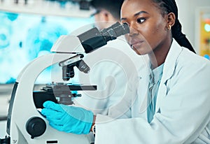 Microscope, scientific and female scientist working in a medical study in pharmaceutical lab. Professional, science and