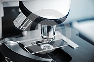 Microscope with slide sample in reseach science laboratory photo