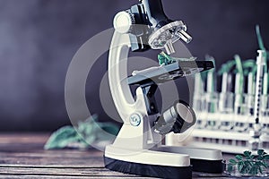 Microscope and test partings on the table in the laboratory