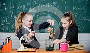 Microscope and test tubes on table. Educational experiment concept. Be careful performing chemical reaction. Basic