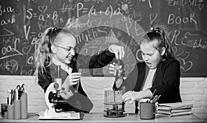 Microscope and test tubes on table. Educational experiment concept. Be careful performing chemical reaction. Basic