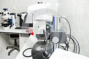 Microscope to check tests in hospital. Concept - health and medicine